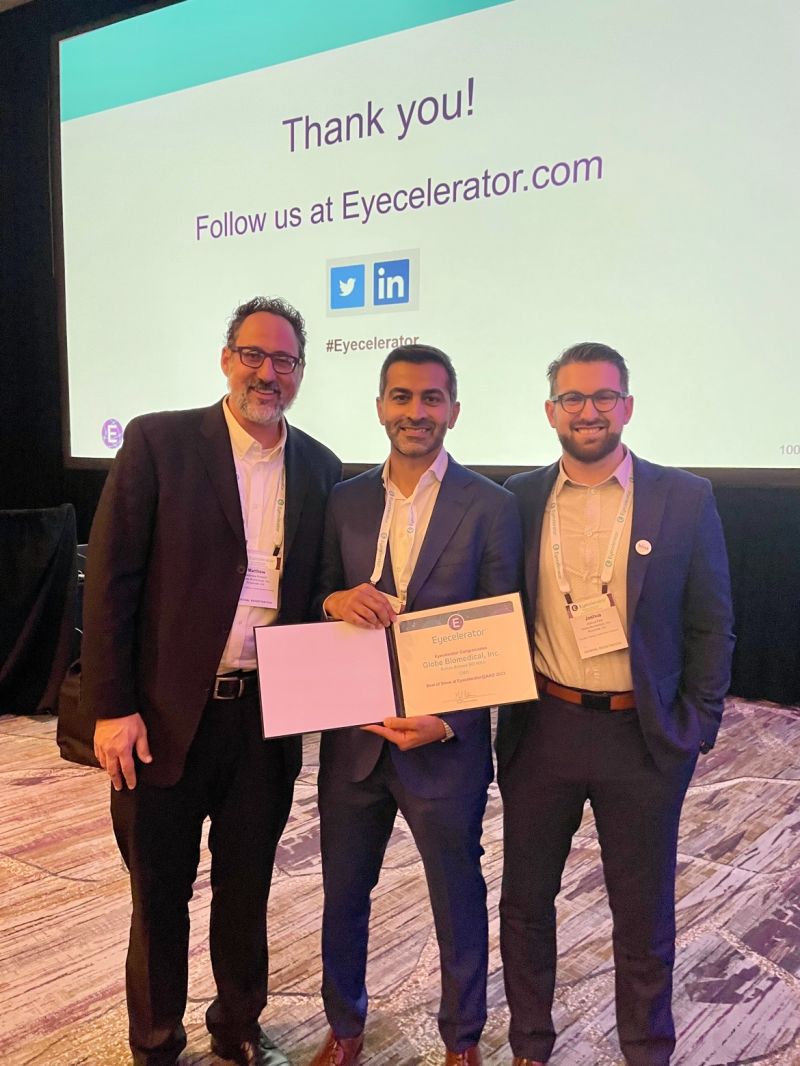 Matthew Rickard, Dr. Rehan Ahmed, and Joshua Park celebrating the Eyecelerator win with a certificate