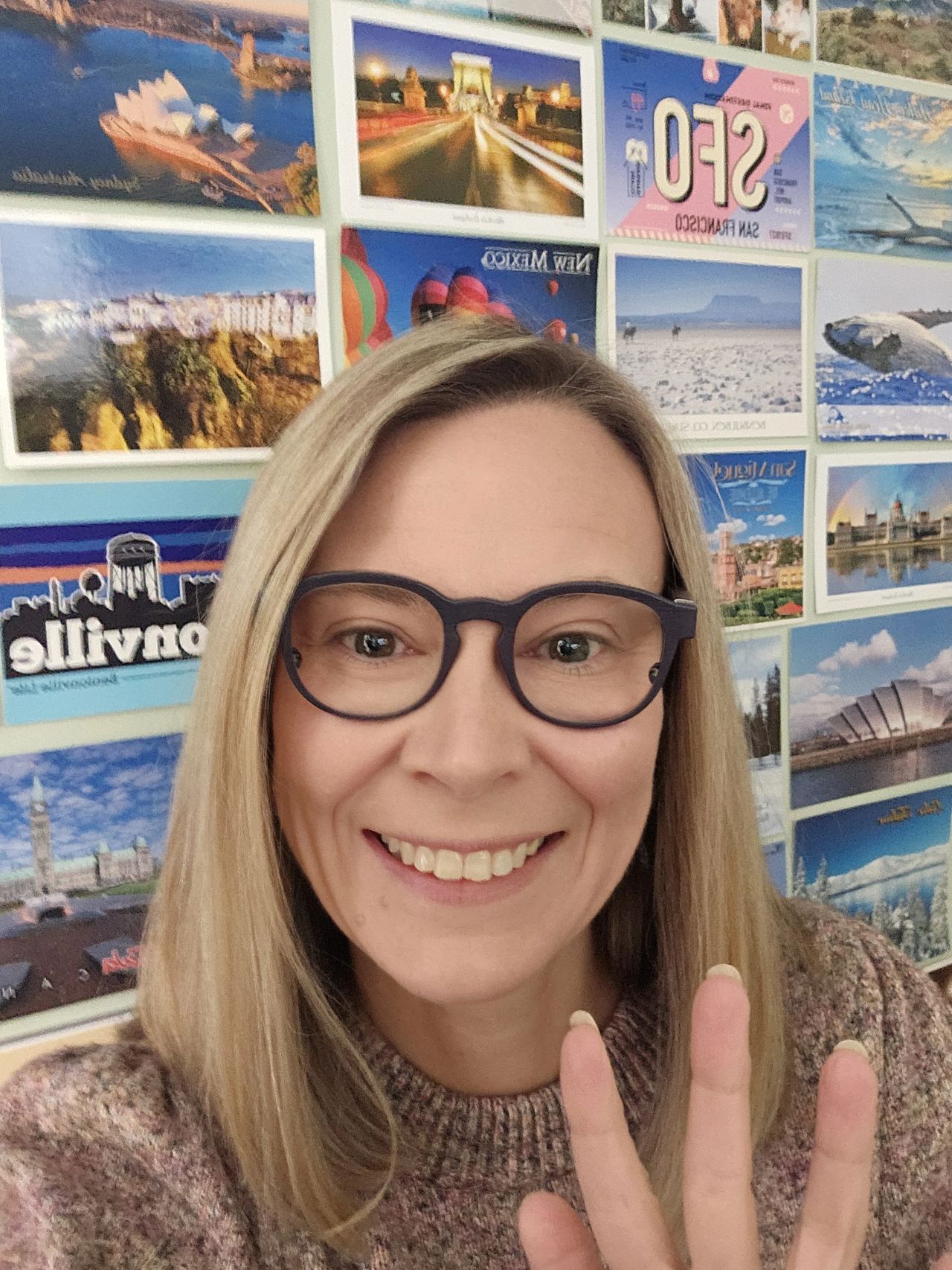 Kelin Kushin wearing Blink smart frames and showing the packaging